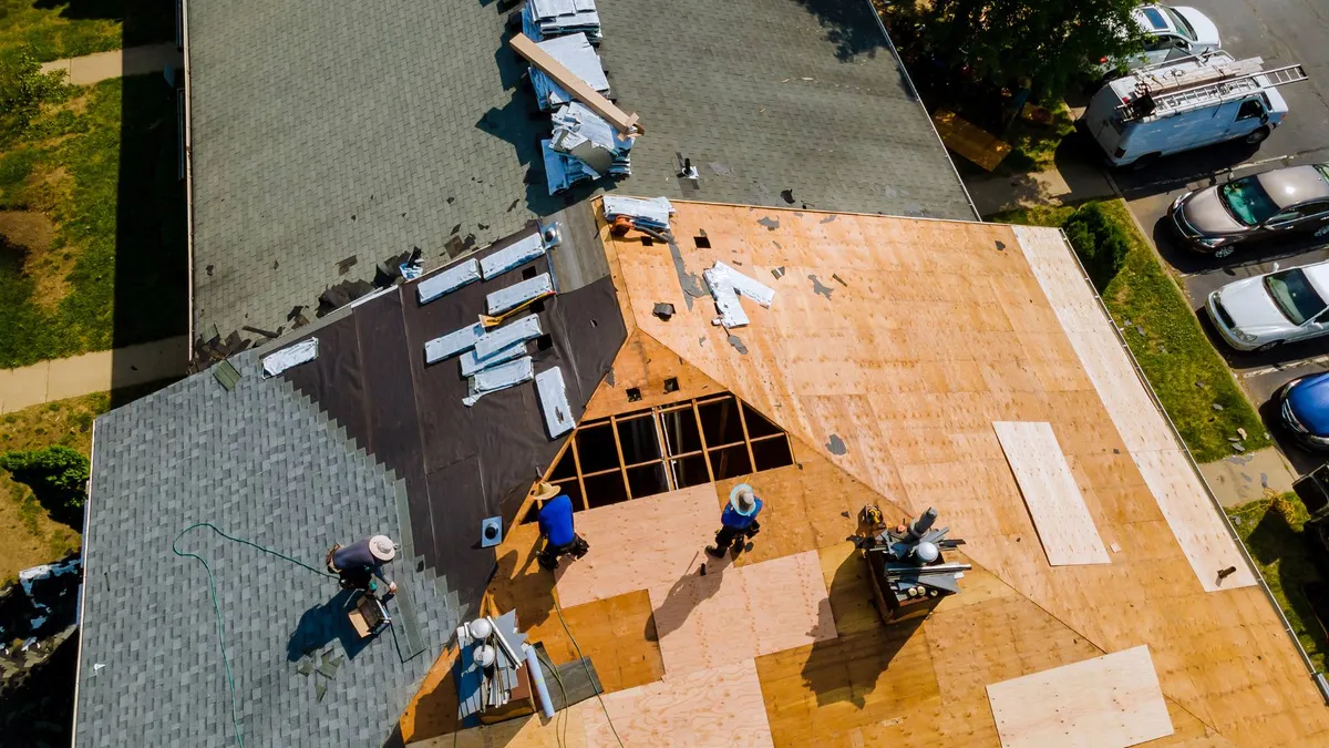 Roof replacement in progress on a residential home